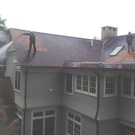 workers are cleaning the roof top