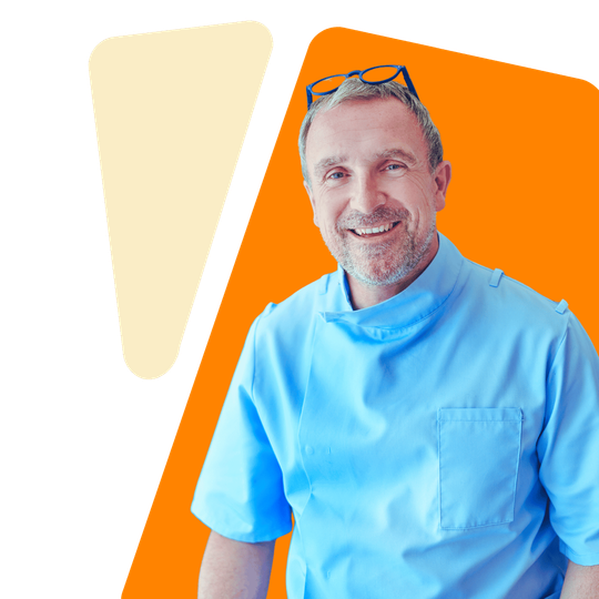 A smiling man in blue scrubs and glasses, possibly a dentist, with an orange and cream design in the background.