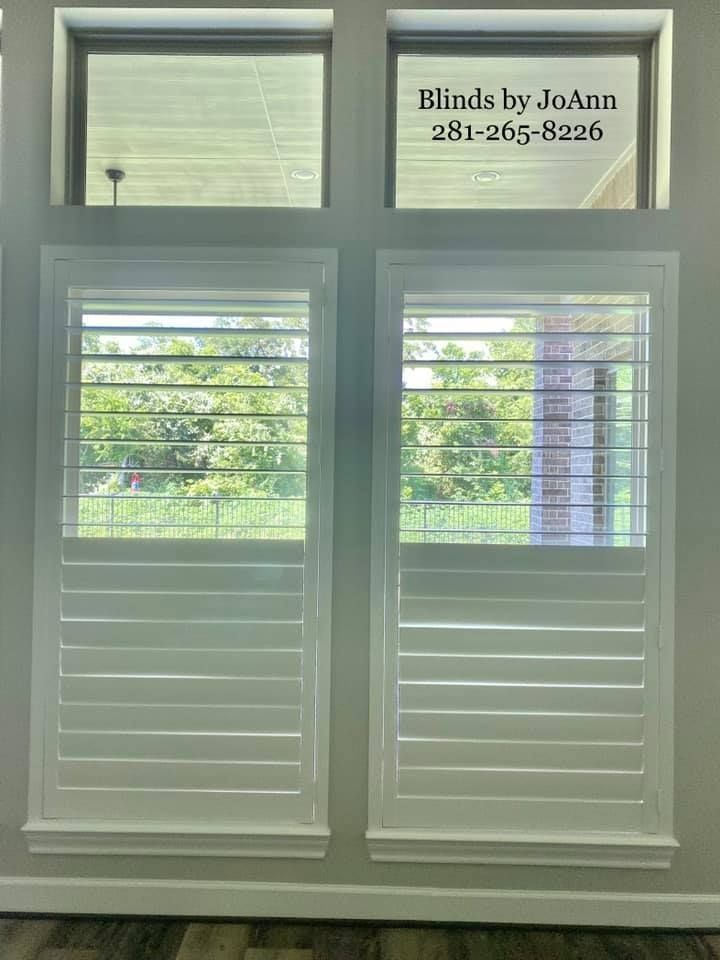 White shutters on two windows with upper panes; 