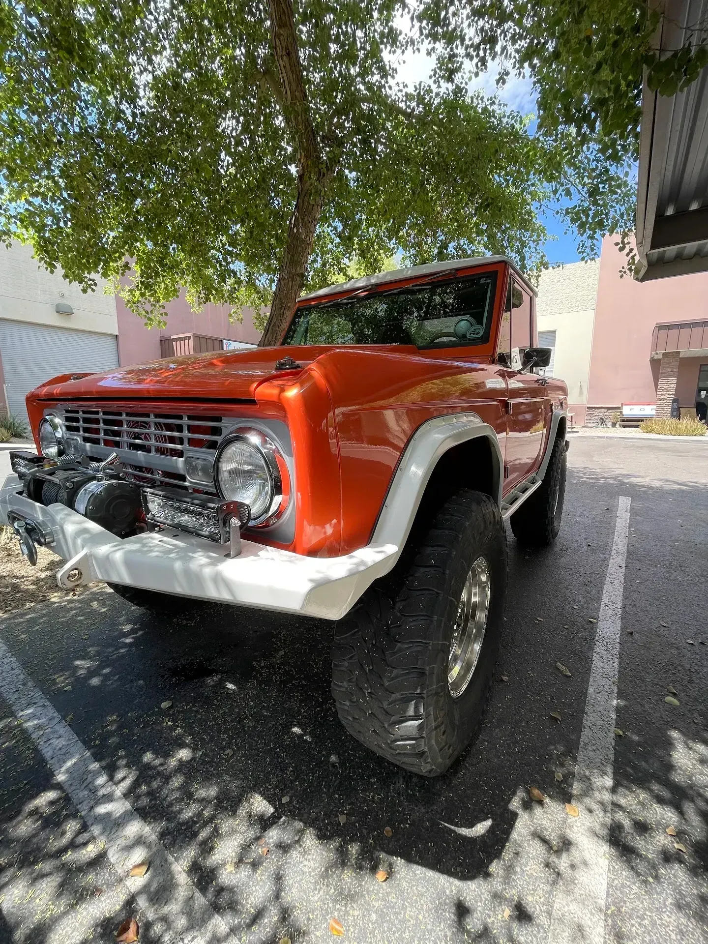 Orange Classic SUV Parked Under a Tree | Wade's Automotive & Exhaust
