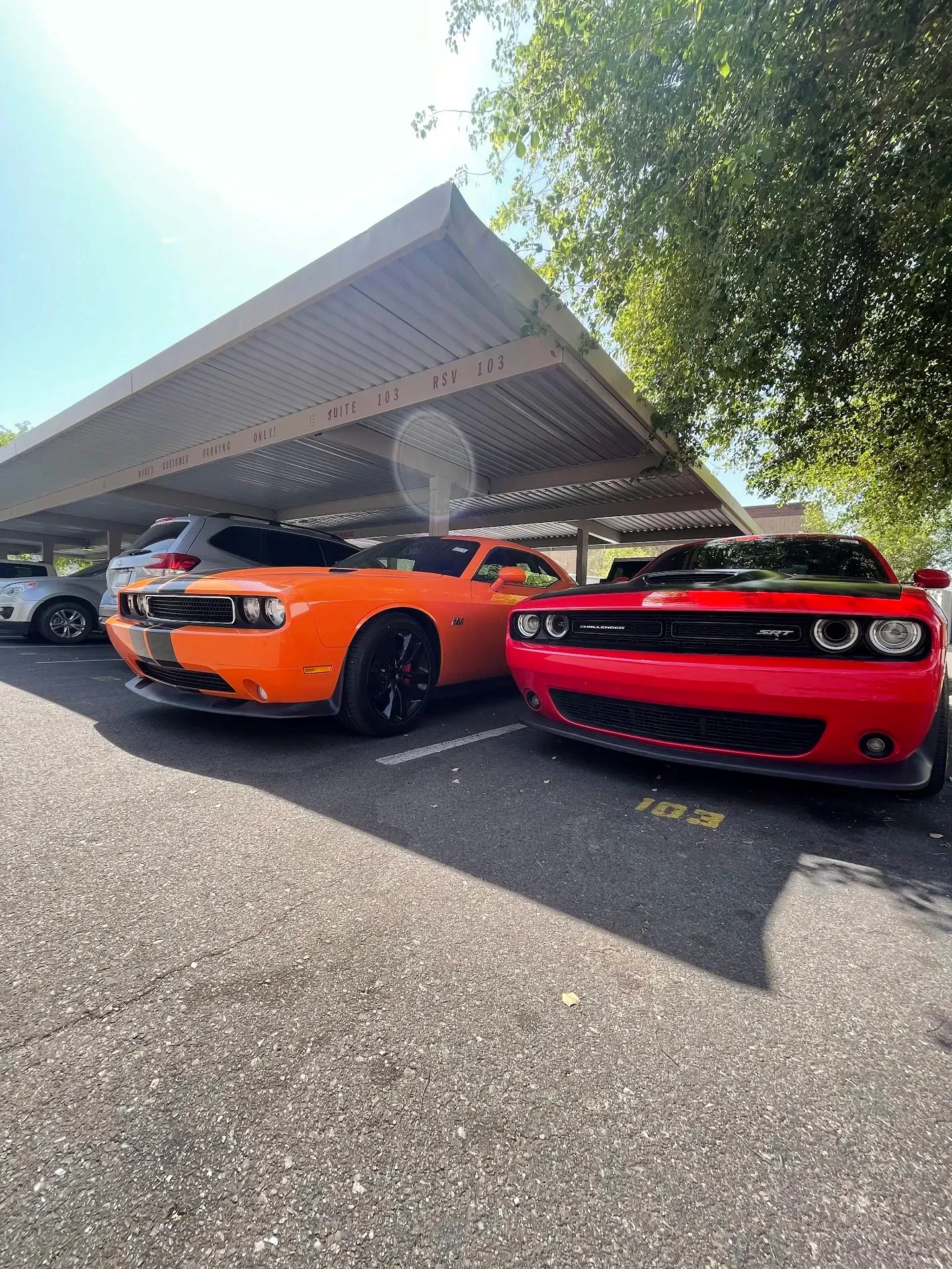 Two Sports Cars, Orange and Red | Wade's Automotive & Exhaust