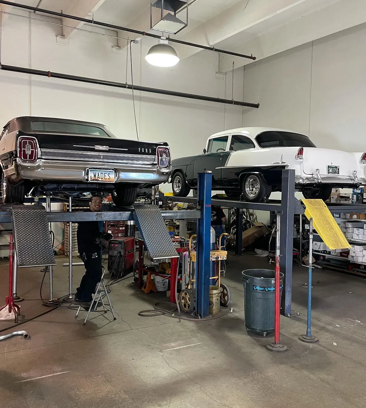 Two Classic Cars on Lifts in an Auto Repair Shop | Wade's Automotive & Exhaust