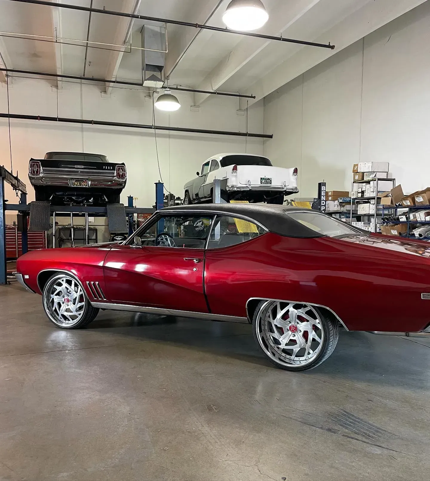 Red Classic Muscle Car with Chrome Rims | Wade's Automotive & Exhaust