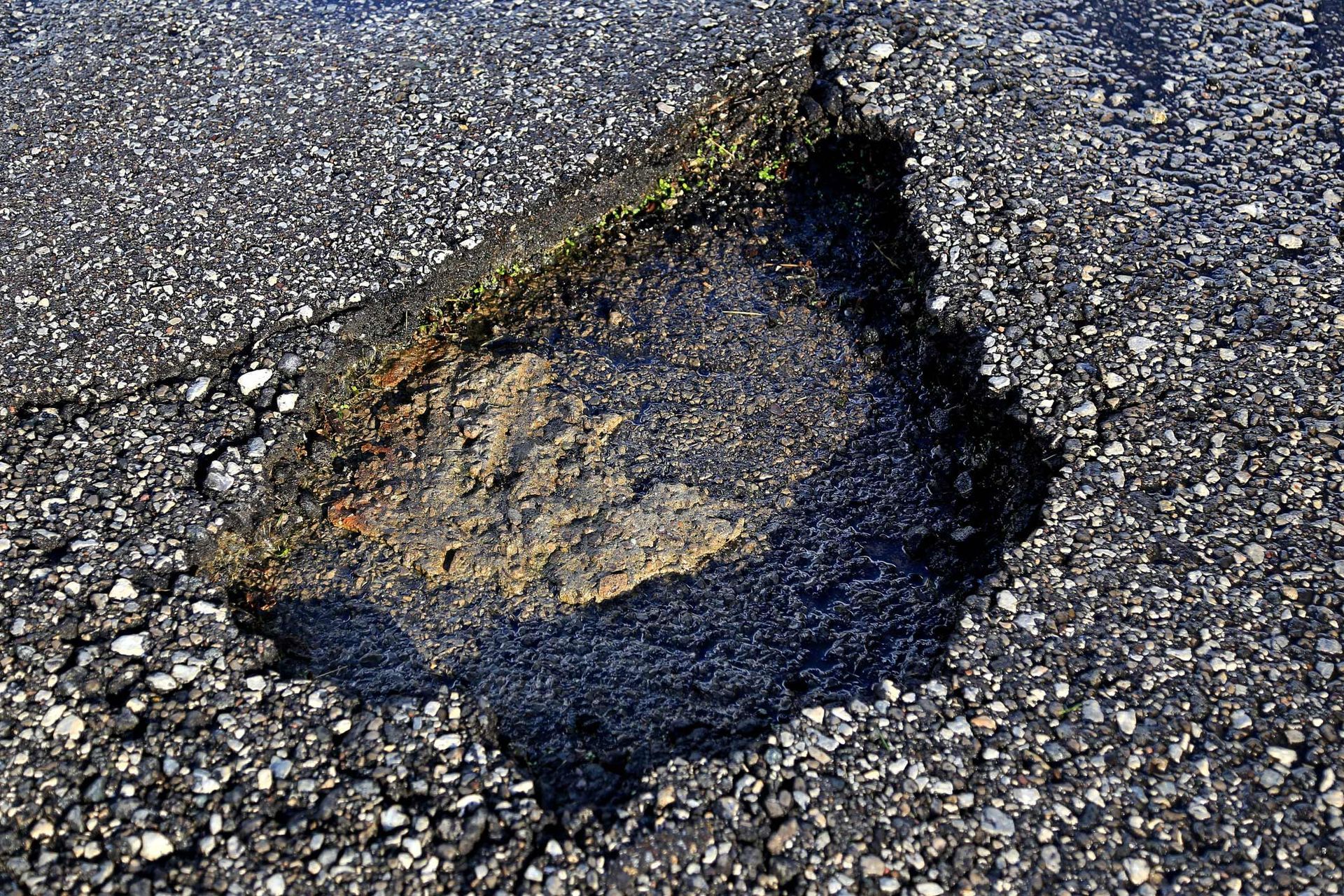 Pothole in the Asphalt Paved Road — Bear, DE — Smith Paving & Contracting, Inc.