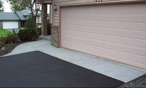 Pink Garage Door With a Black Driveway — Bear, DE — Smith Paving & Contracting, Inc.