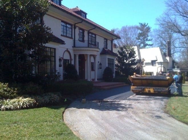 Large White House With a Yellow Dumpster — Bear, DE — Smith Paving & Contracting, Inc.