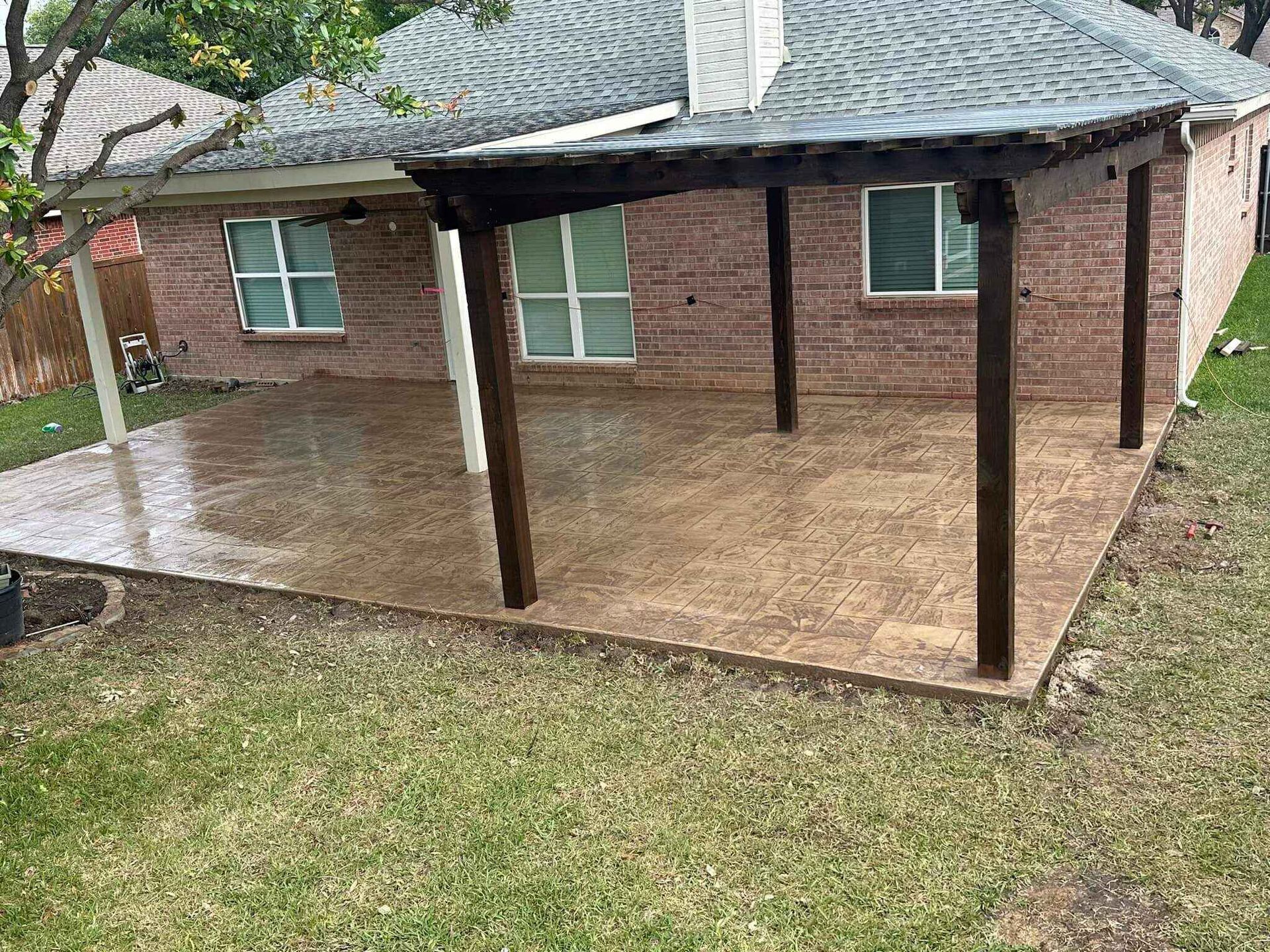 pergola installed on stamped concrete pad in Dallas