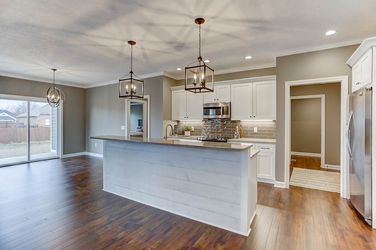 There is a large island in the middle of the kitchen.