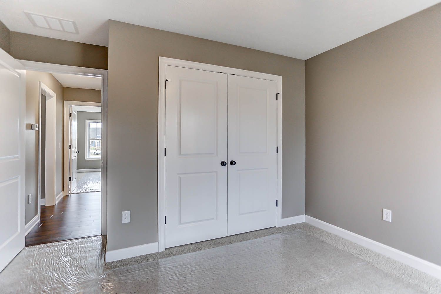 There is a closet in the middle of the room.