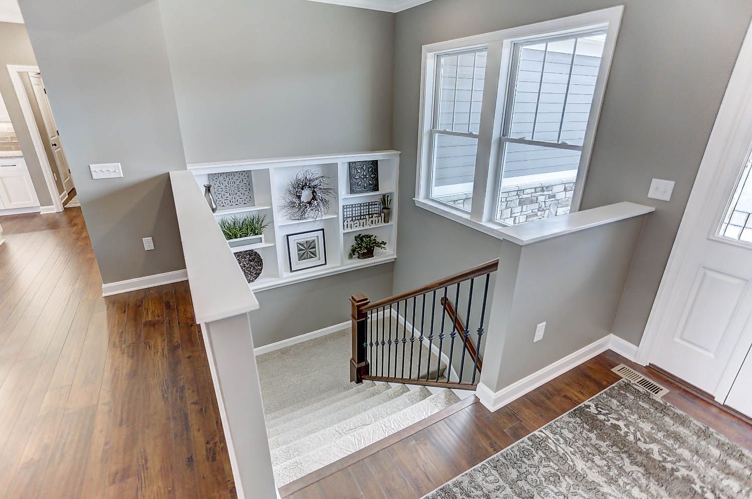 An aerial view of a staircase leading up to the second floor of a house.