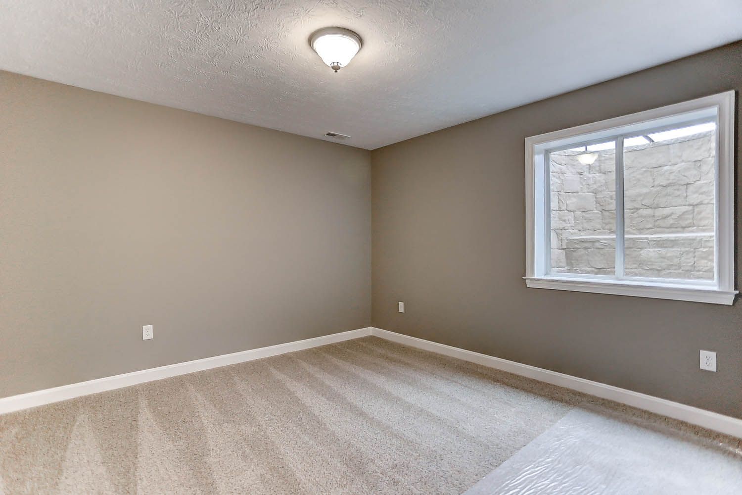 There is a large window in the middle of the room.