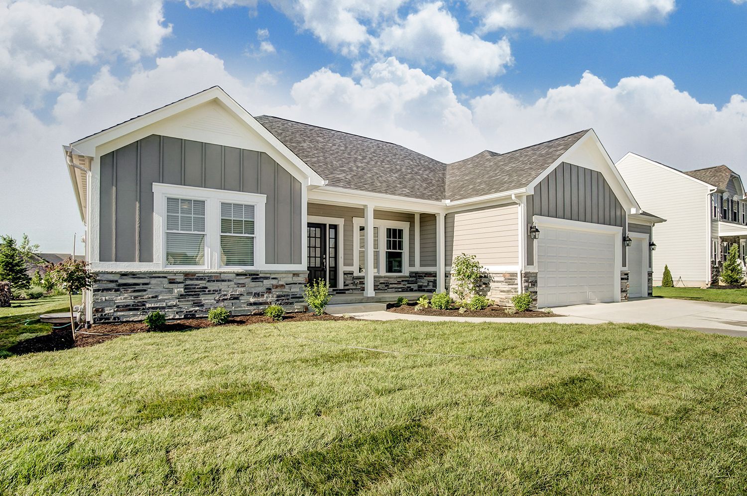 A large house with a lot of grass in front of it.