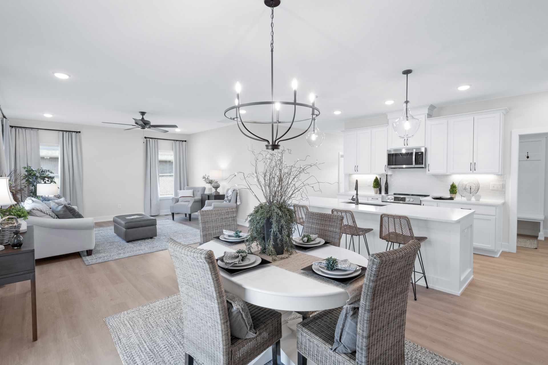 There is a dining table and chairs in the middle of the room.