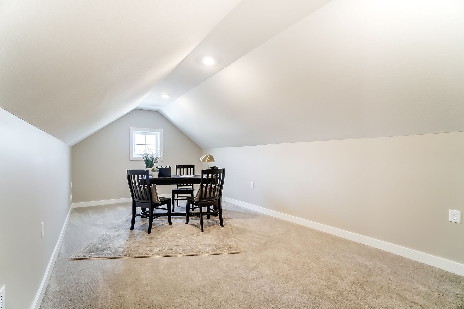There is a table and chairs in the attic.