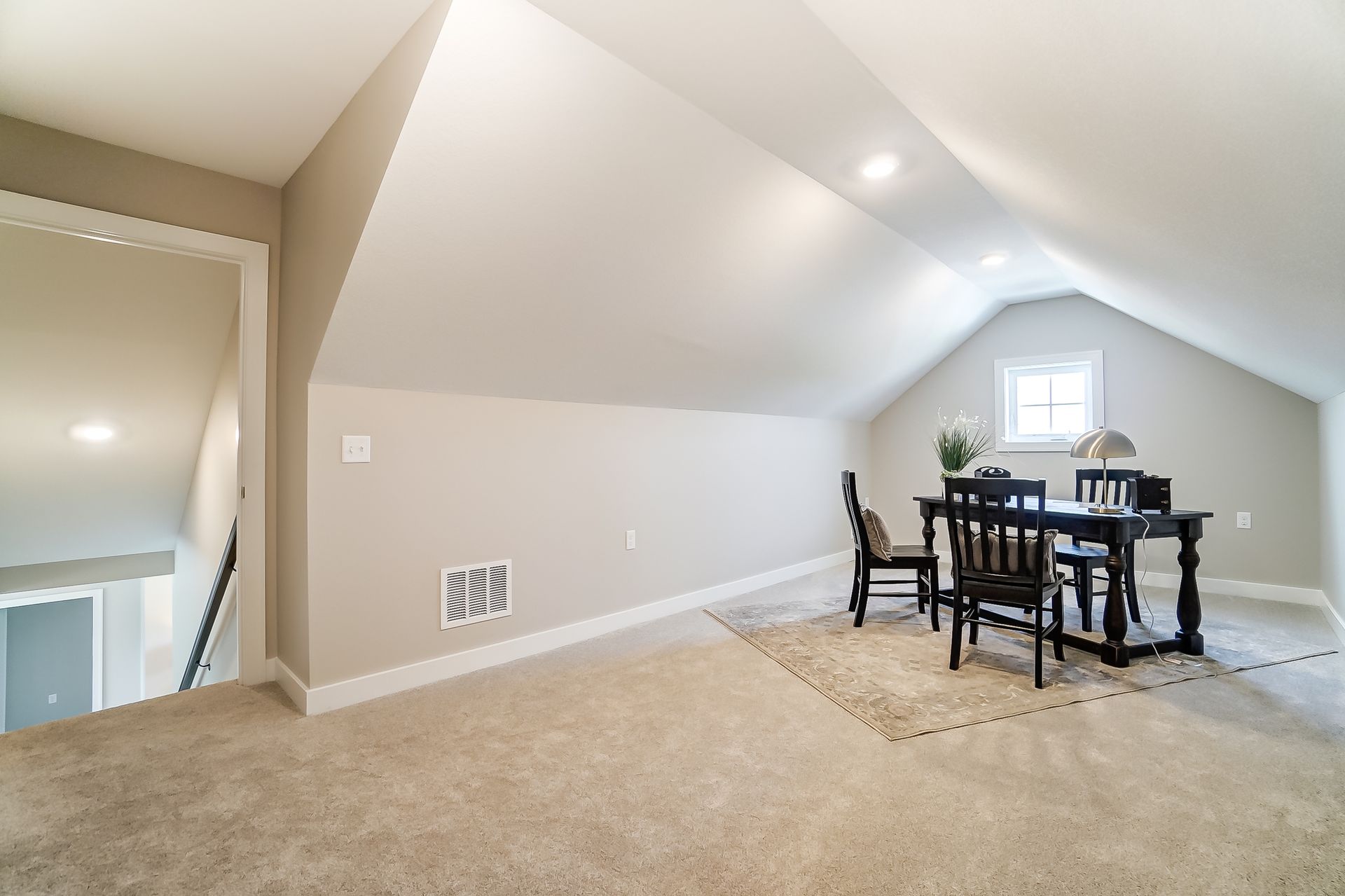 There is a table and chairs in the attic.
