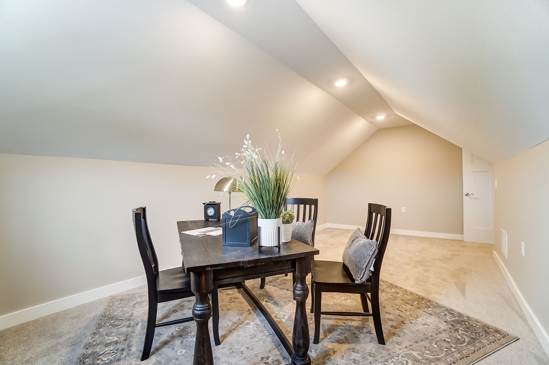 There is a table and chairs in the attic.