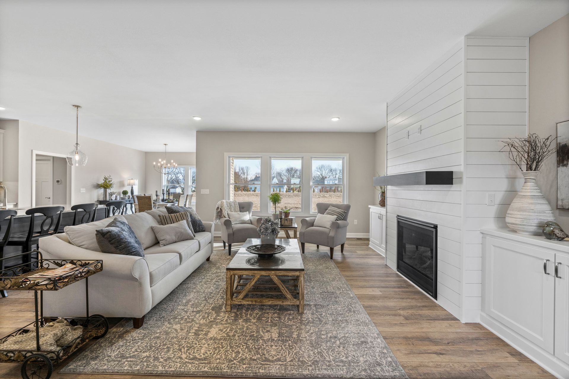 A living room filled with furniture and a fireplace.