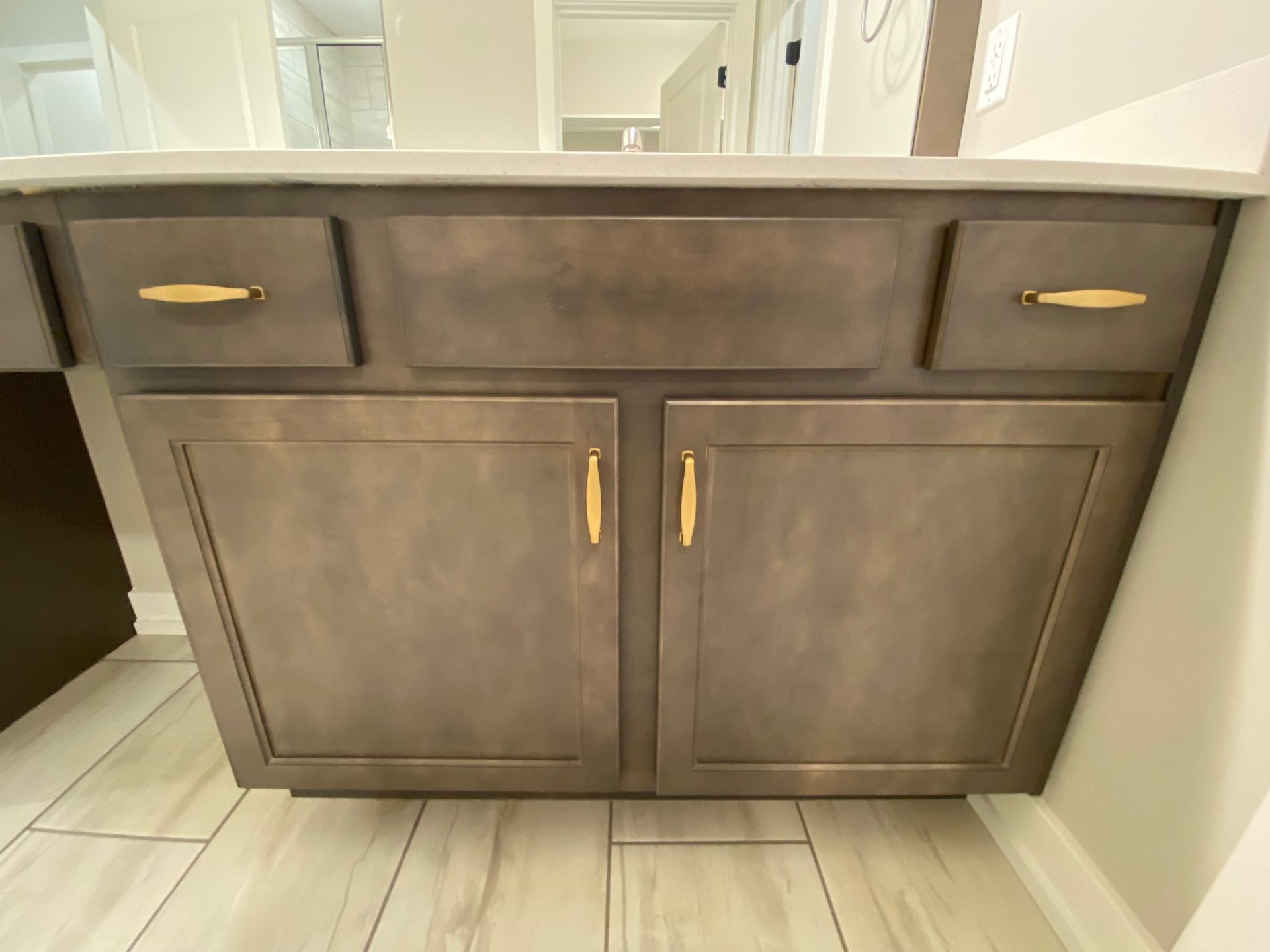 A bathroom vanity with two drawers and two doors.