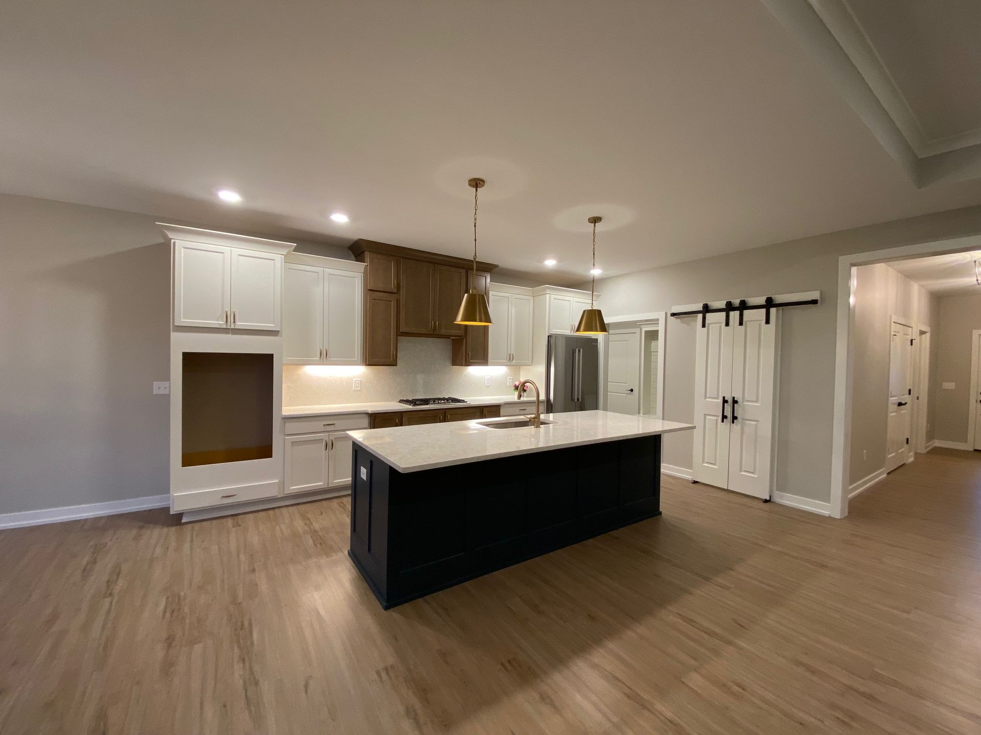 There is a large island in the middle of the kitchen.