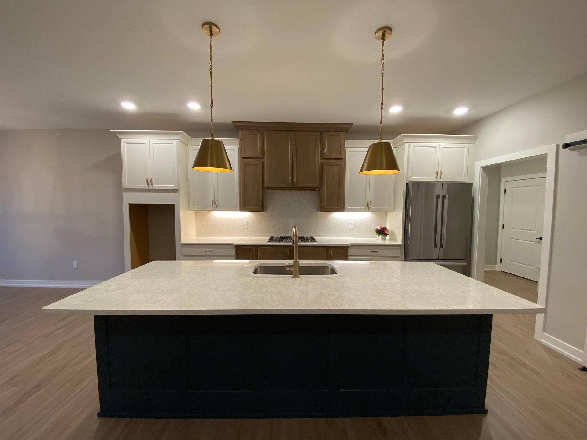 There is a large island in the middle of the kitchen.