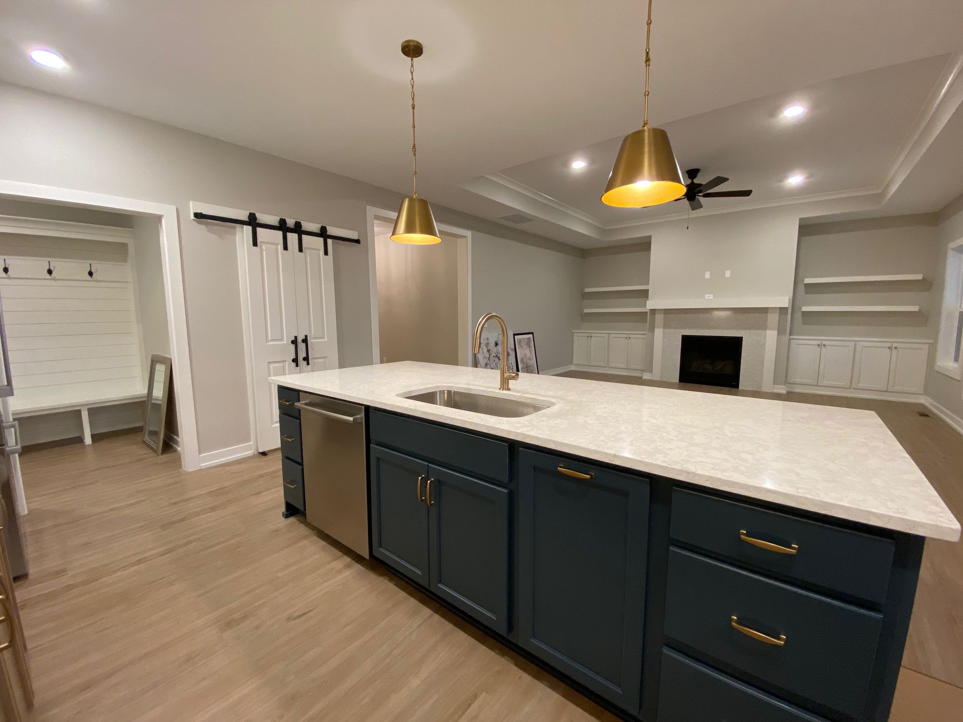There is a large island in the middle of the kitchen.