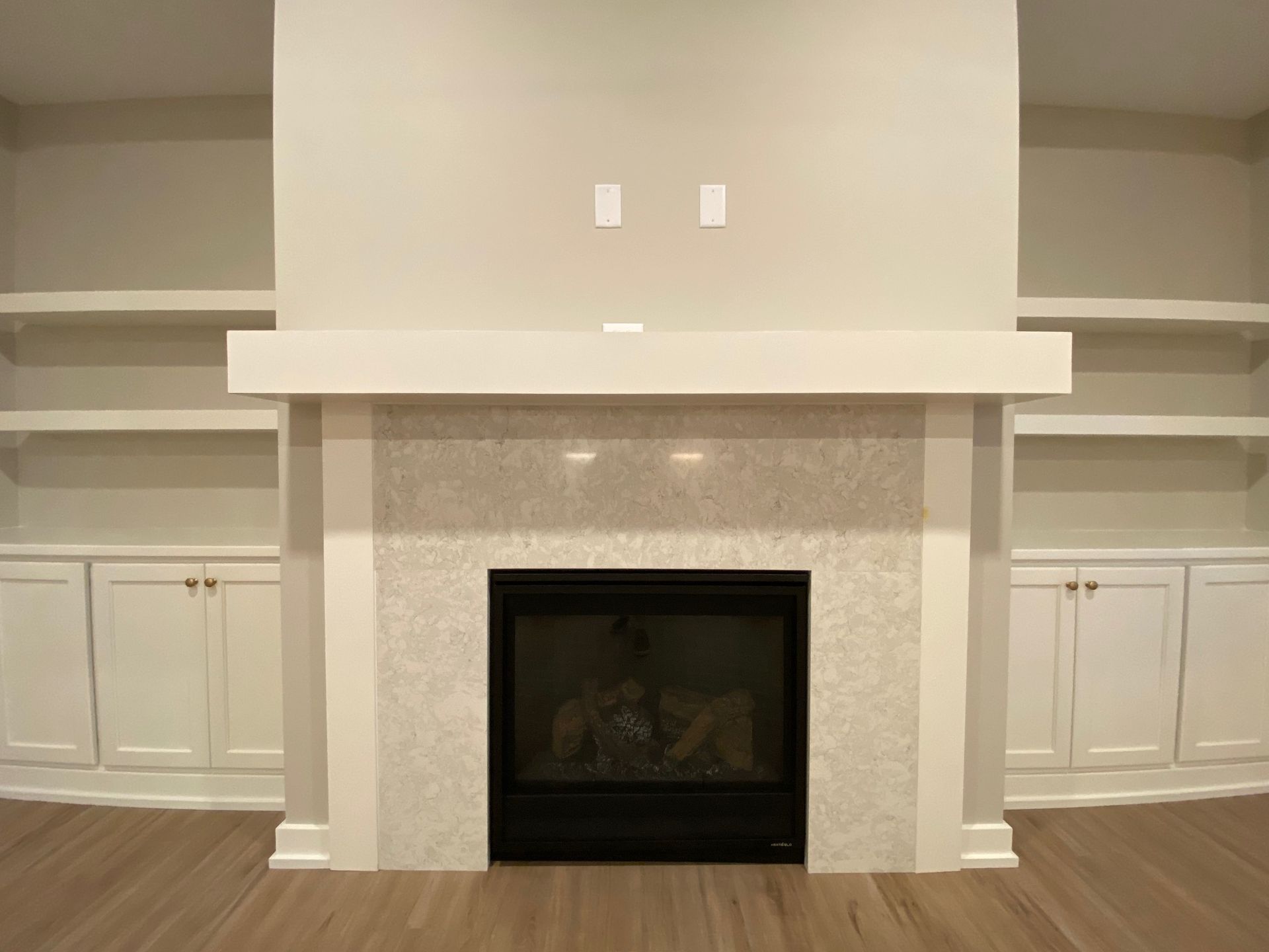 There is a fireplace in the middle of the room.