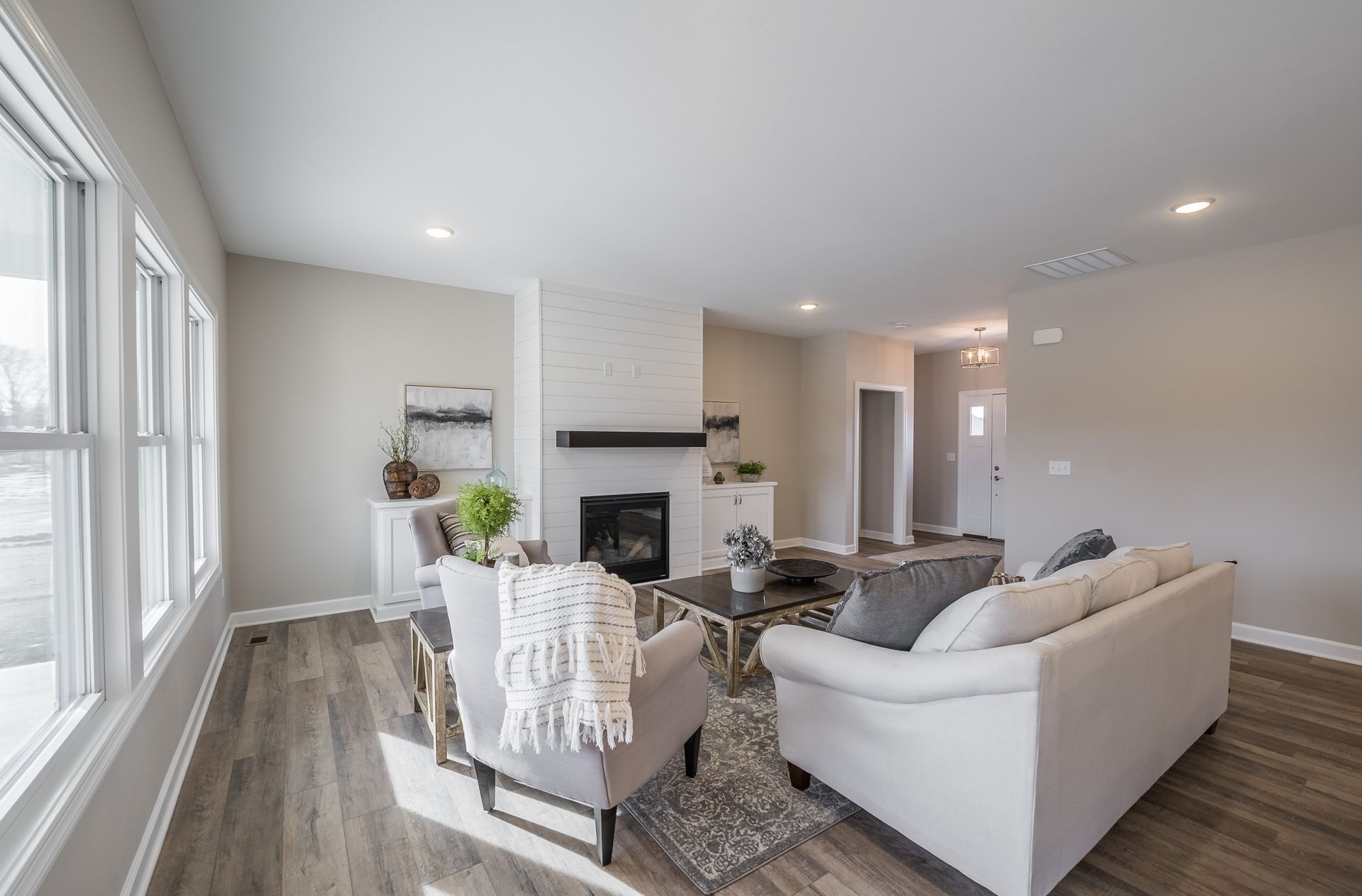A living room filled with furniture and a fireplace.