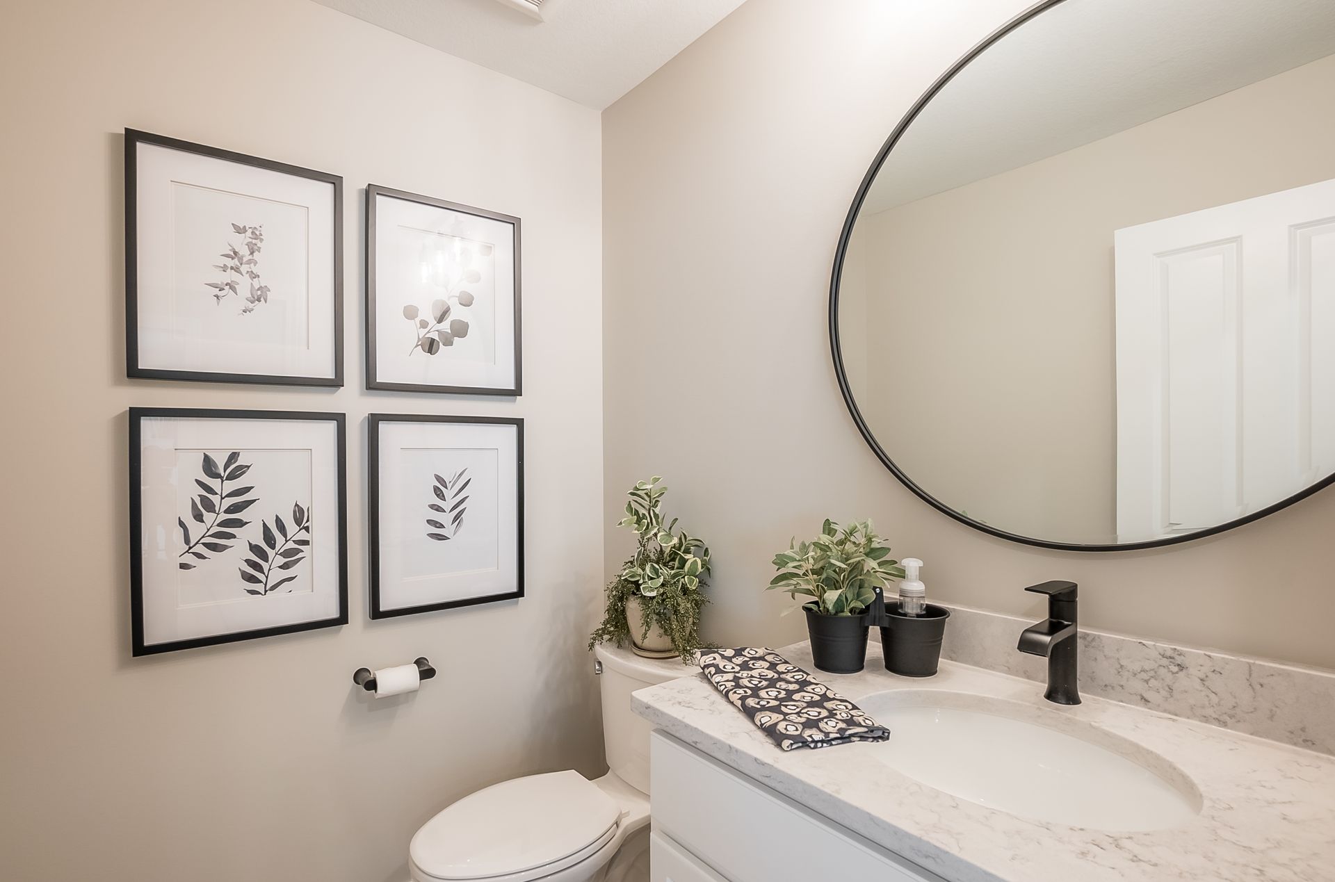 A bathroom with a sink , toilet , and mirror.