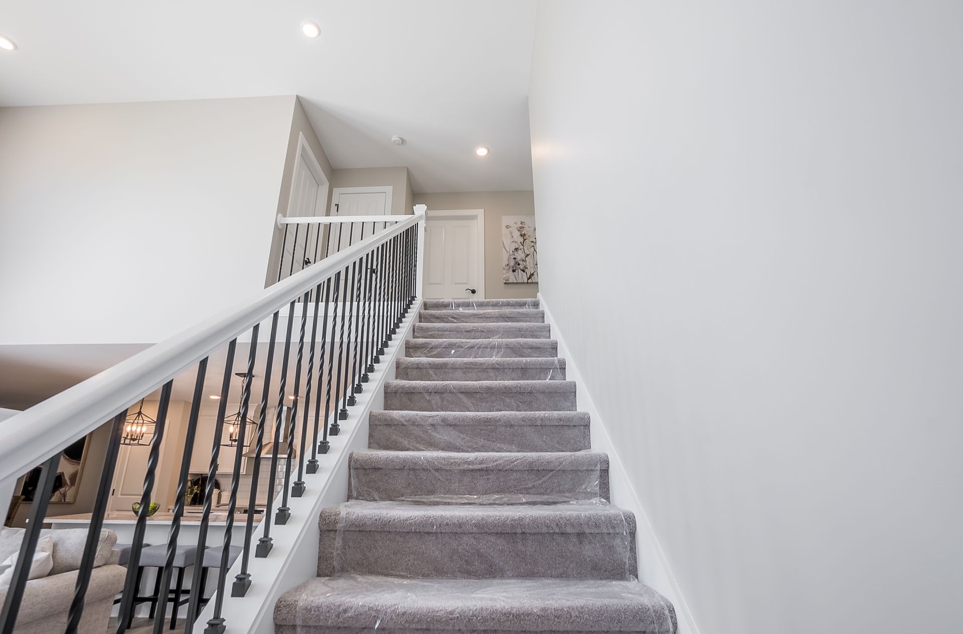 A set of stairs leading up to the second floor of a house.