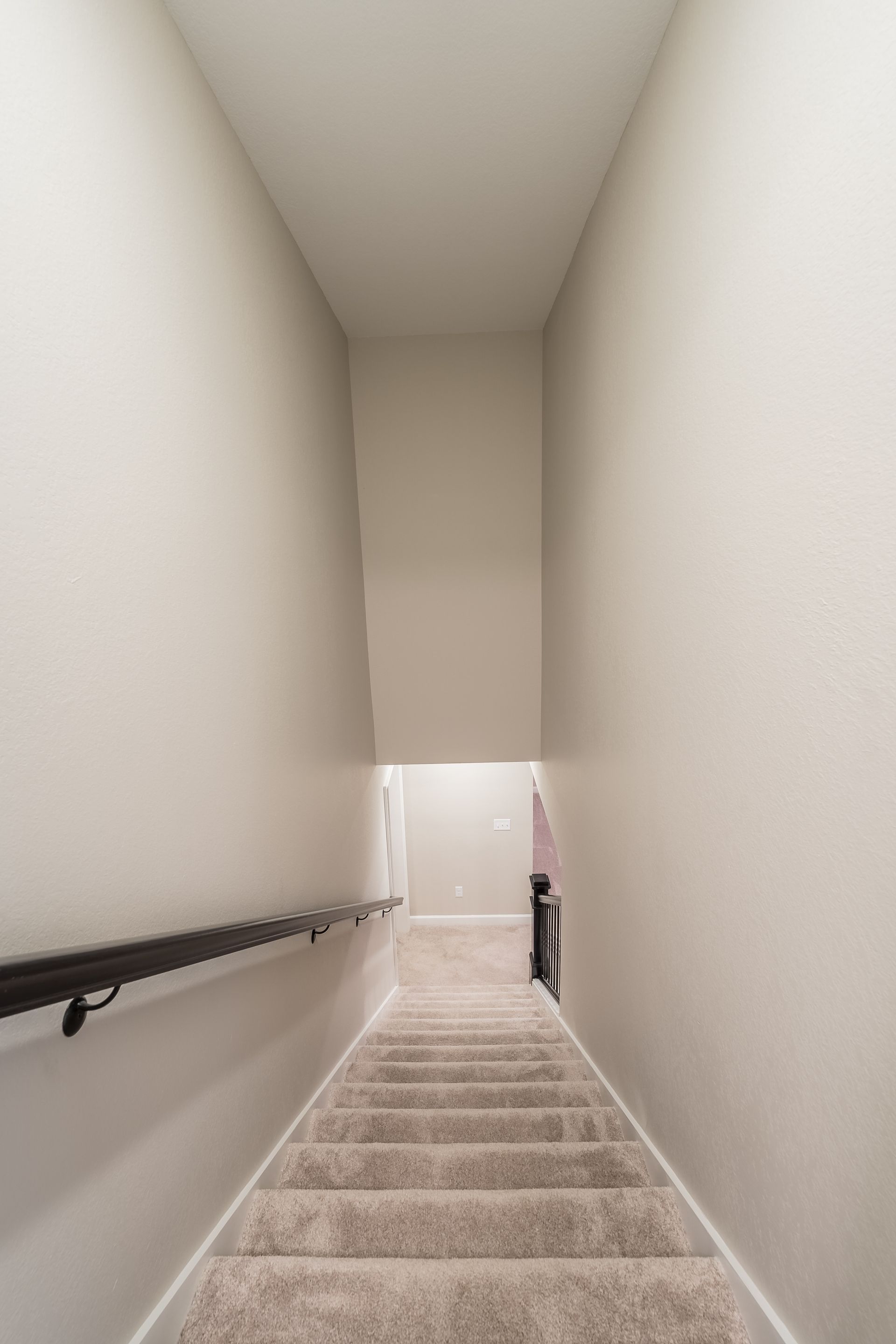 A set of stairs leading up to the second floor of a house.