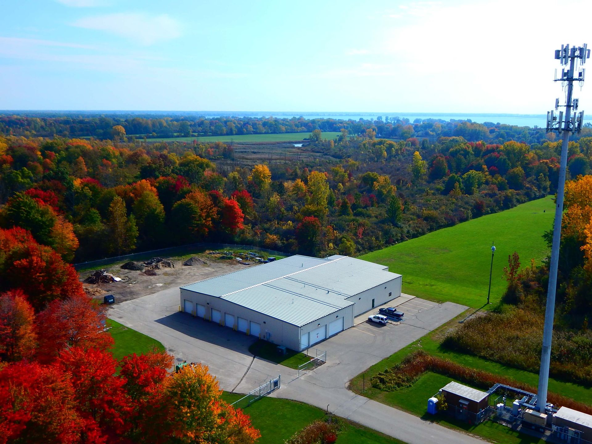 An aerial view of a building in the middle of a field.
