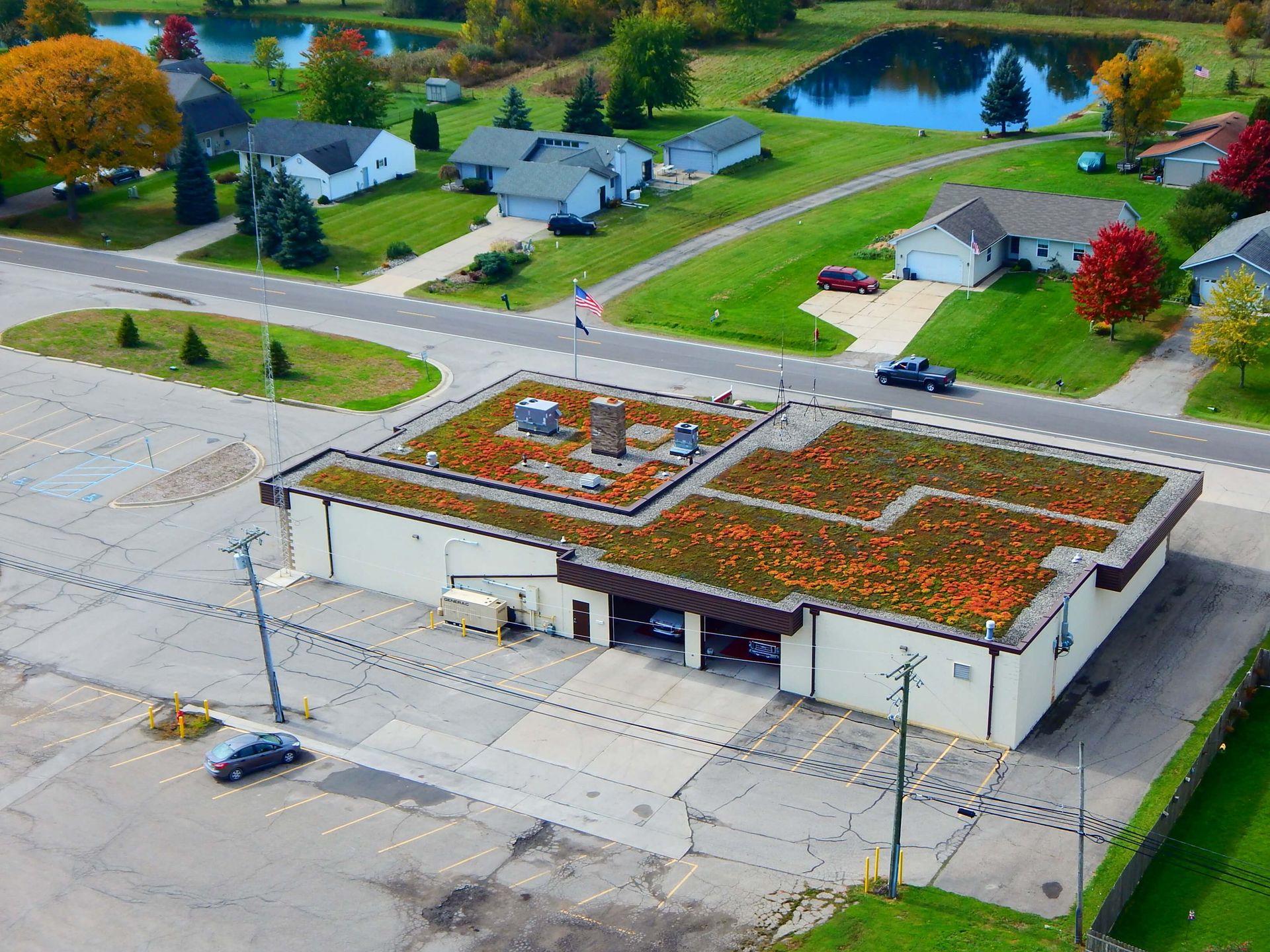 An aerial view of a building with a green roof.