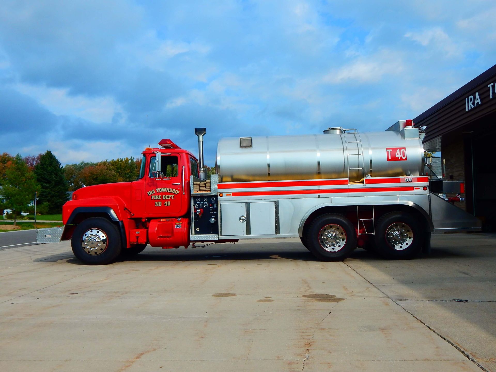 A red and silver truck with Ira Township written on the side.