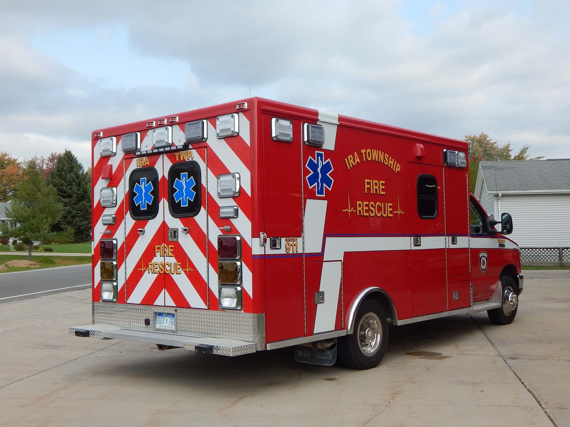 A red and white ambulance with the word 'rescue' on the side.