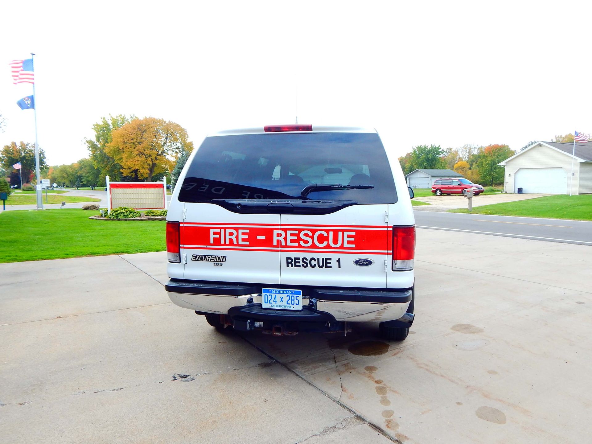 A fire rescue vehicle is parked in a driveway.