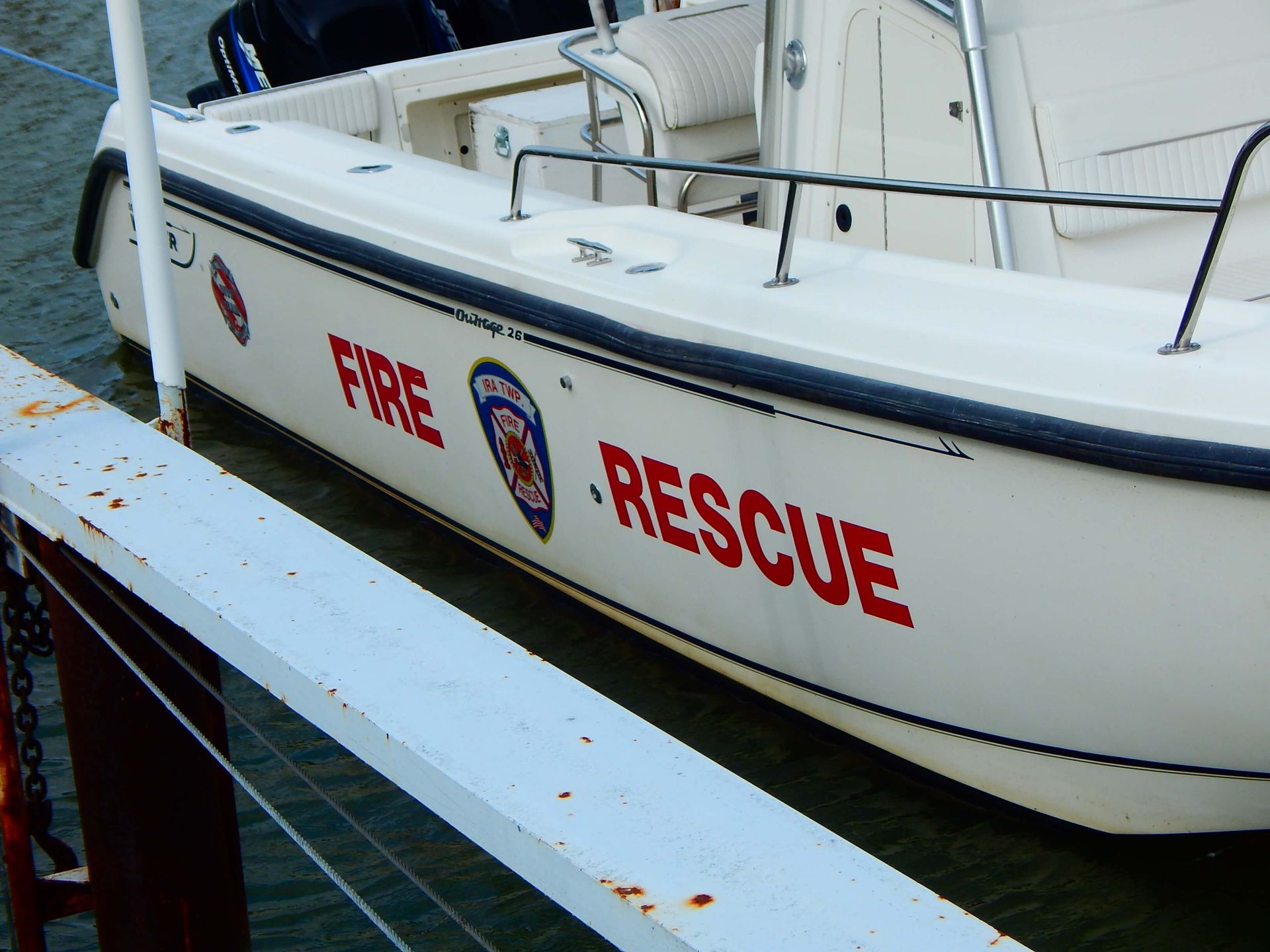 A white boat with 'fire rescue' written on the side.