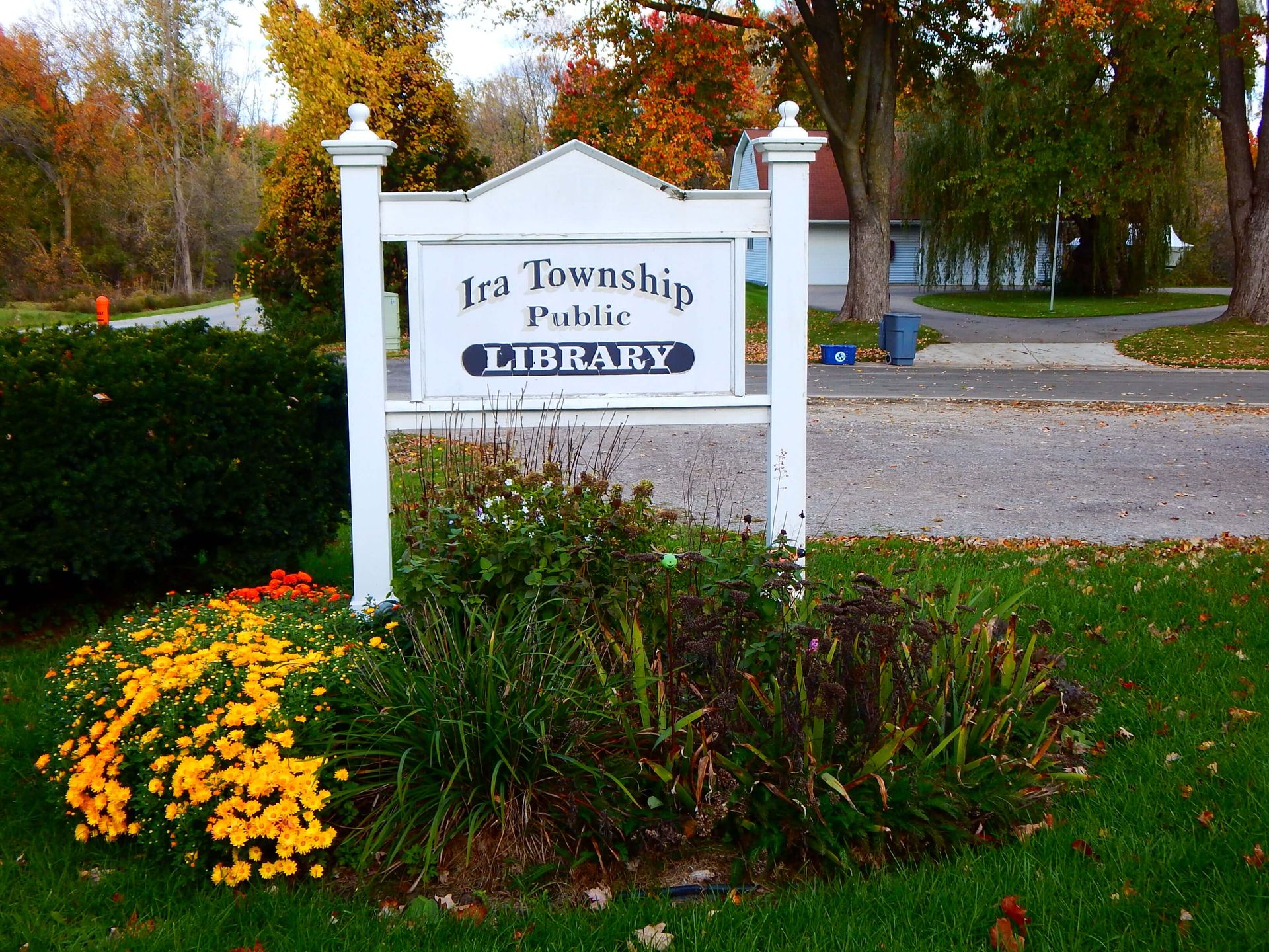 A sign for the Ira Township Public Library.