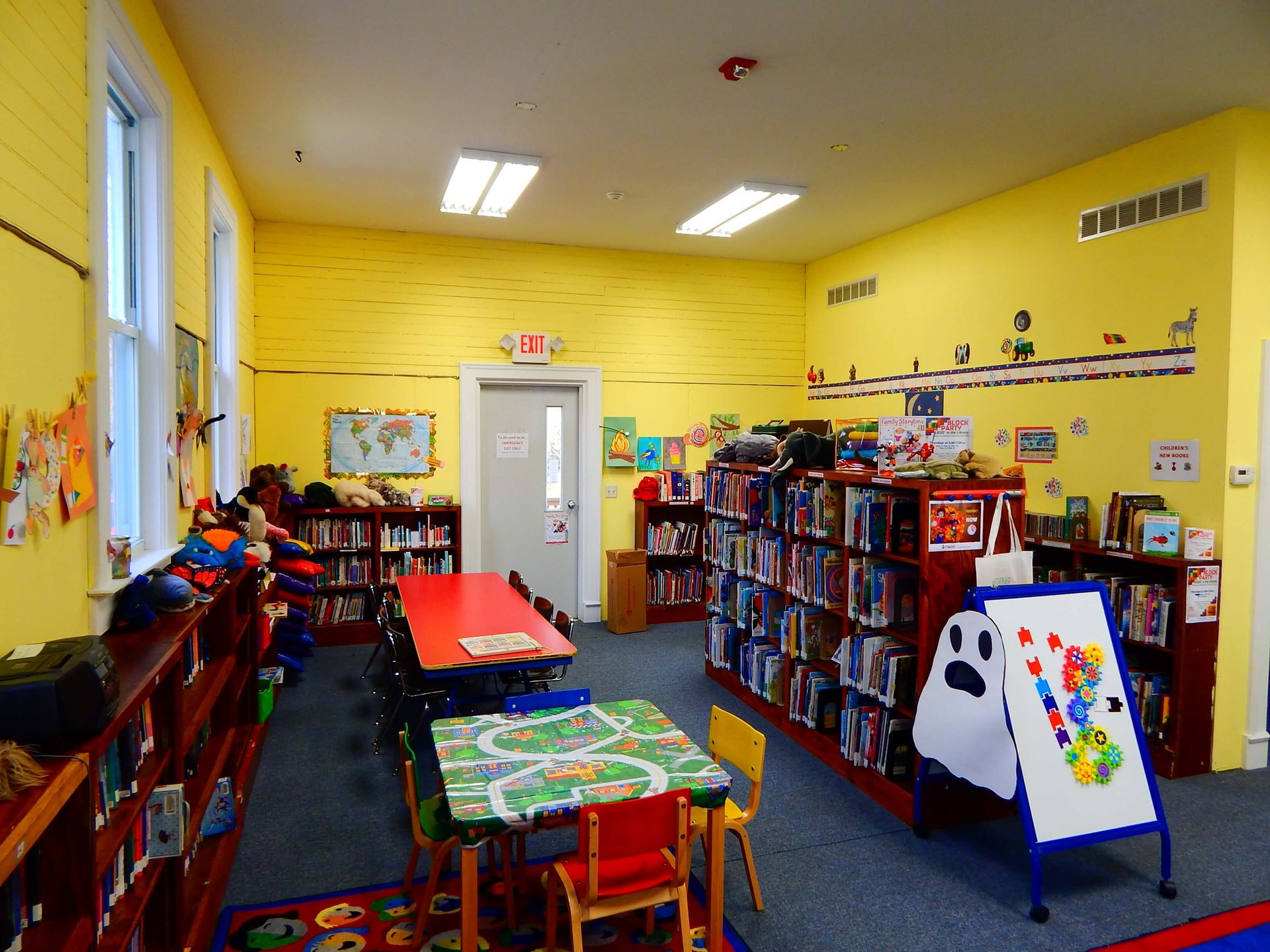 A children's library with a table and chairs.