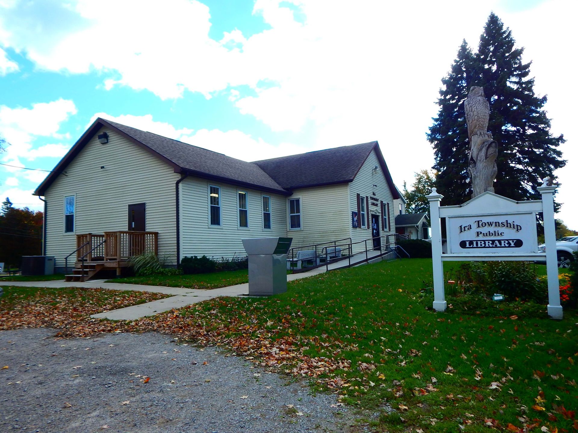 A large white building with a sign that says ' the theatre ' on it