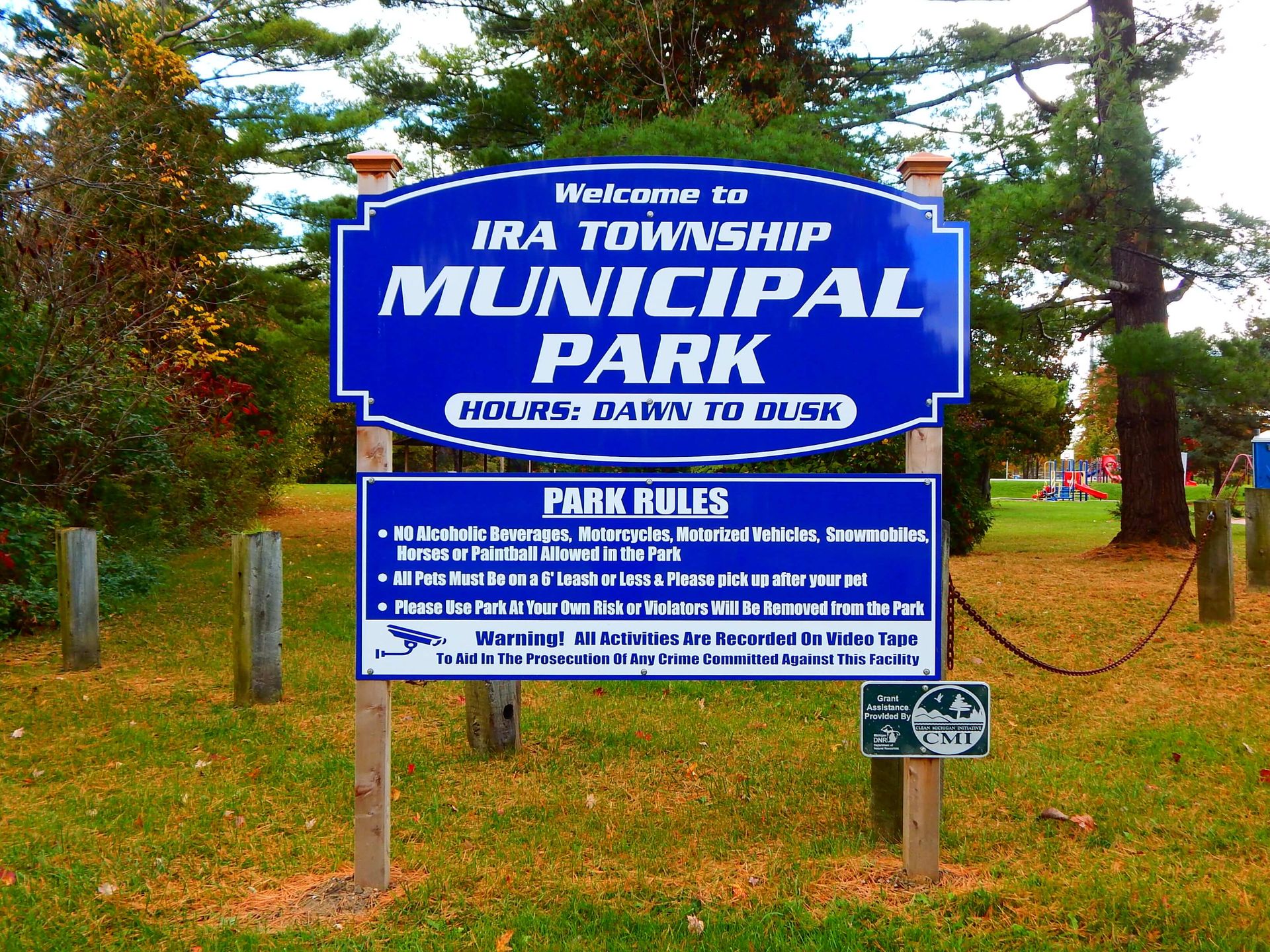 A blue sign says Welcome to Ira Township Municipal Park.