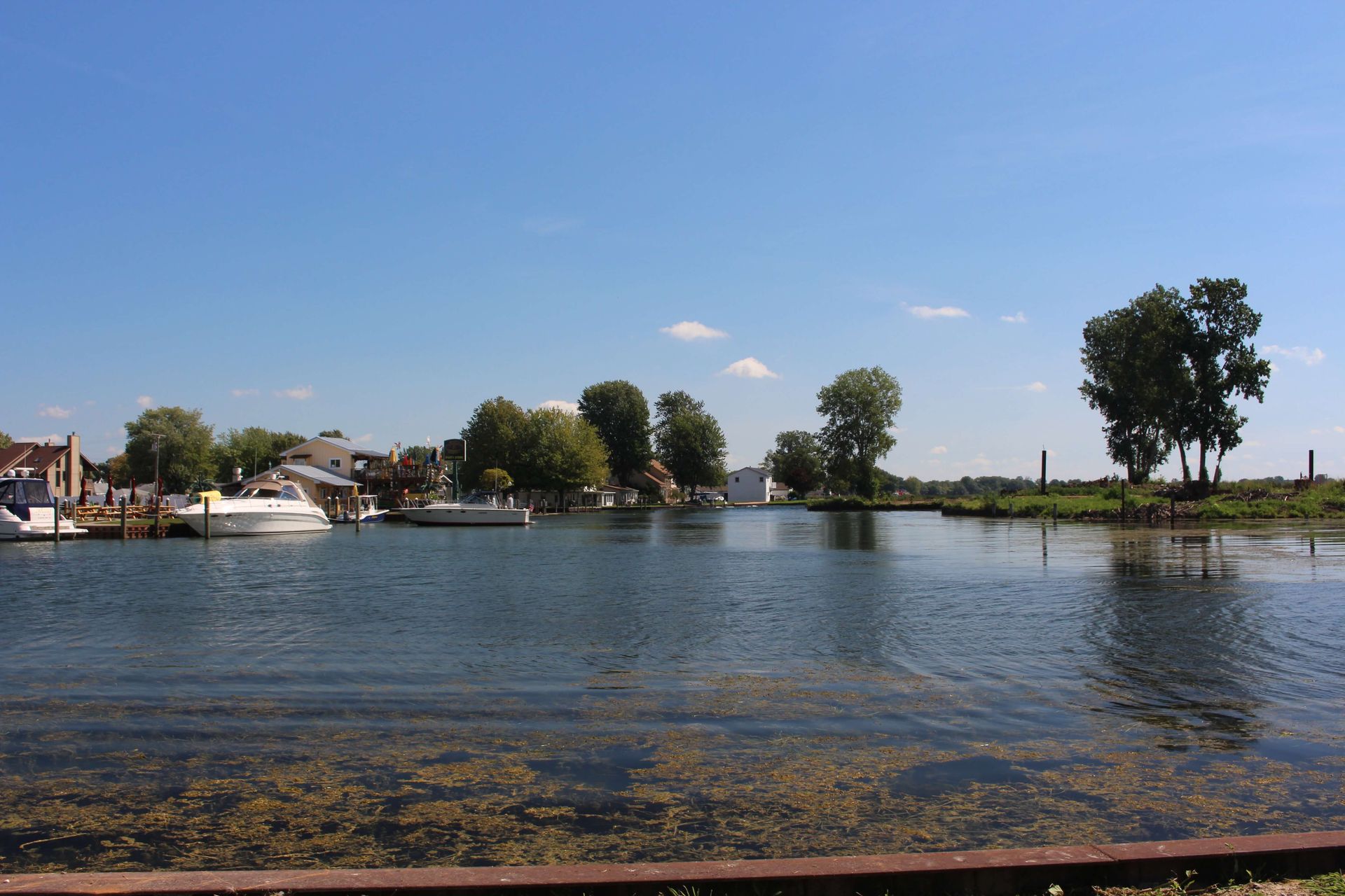 A large body of water with a few boats in it.