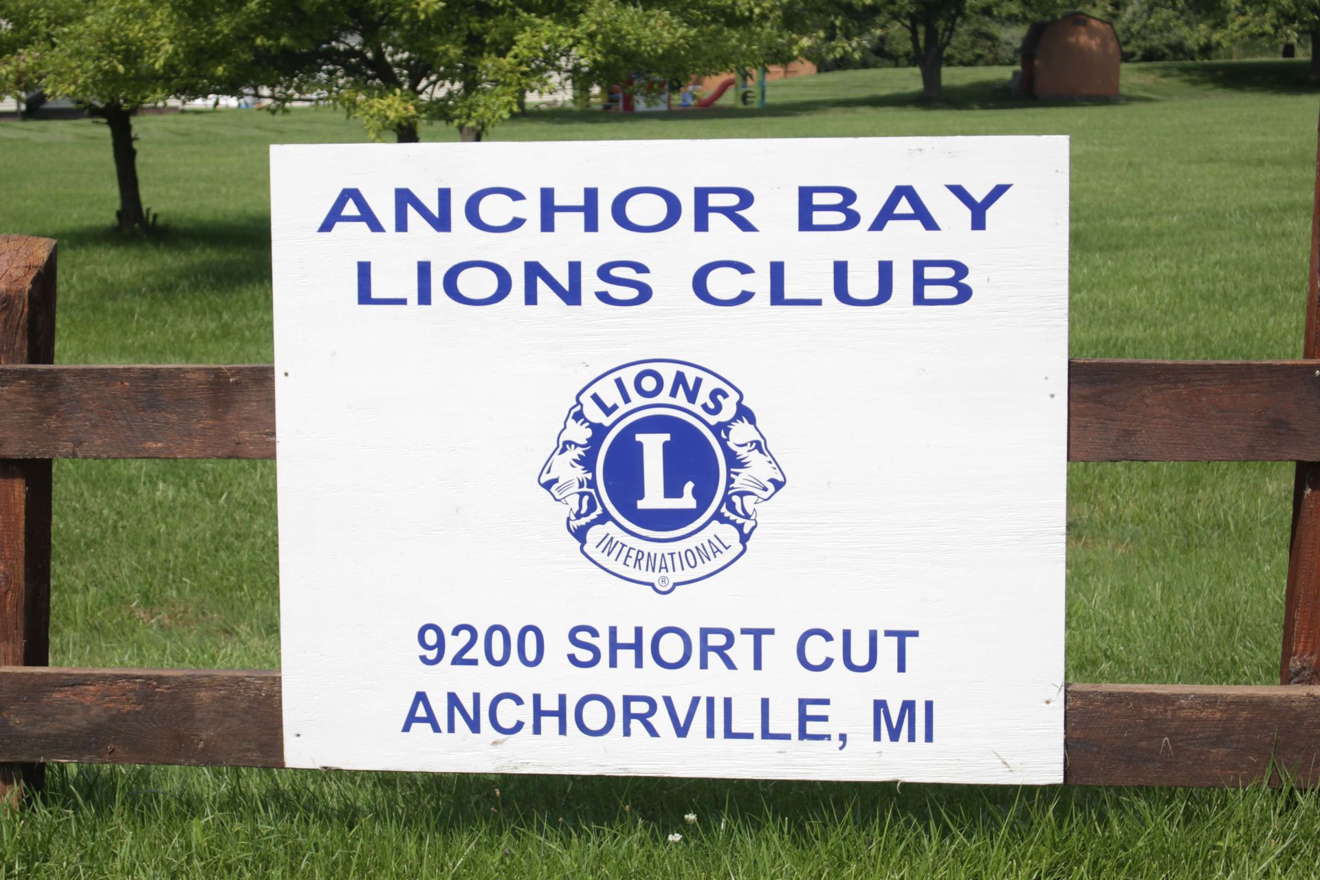 A sign that says Anchor Bay Lions Club on it.