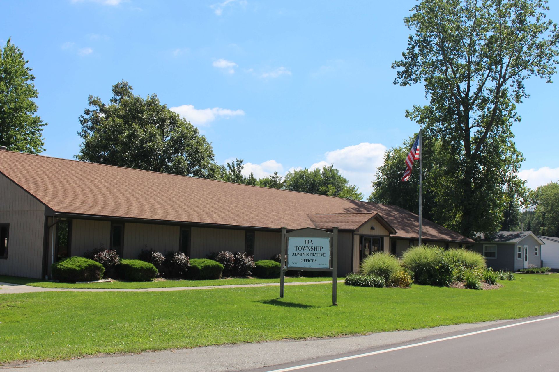 An aerial view of a forest with trees that are changing colors.