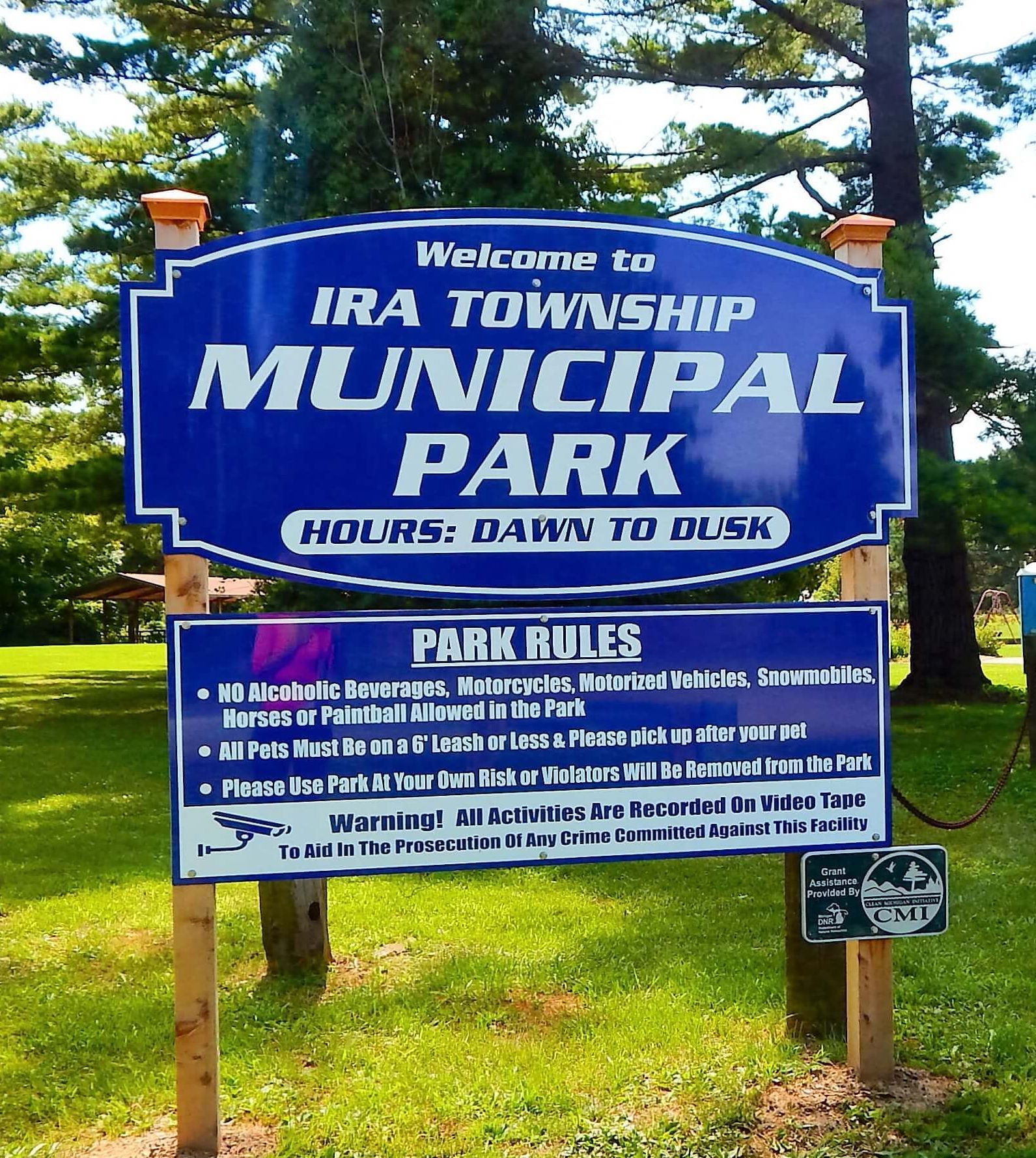 A blue sign that says Welcome to Ira Township Municipal Park.