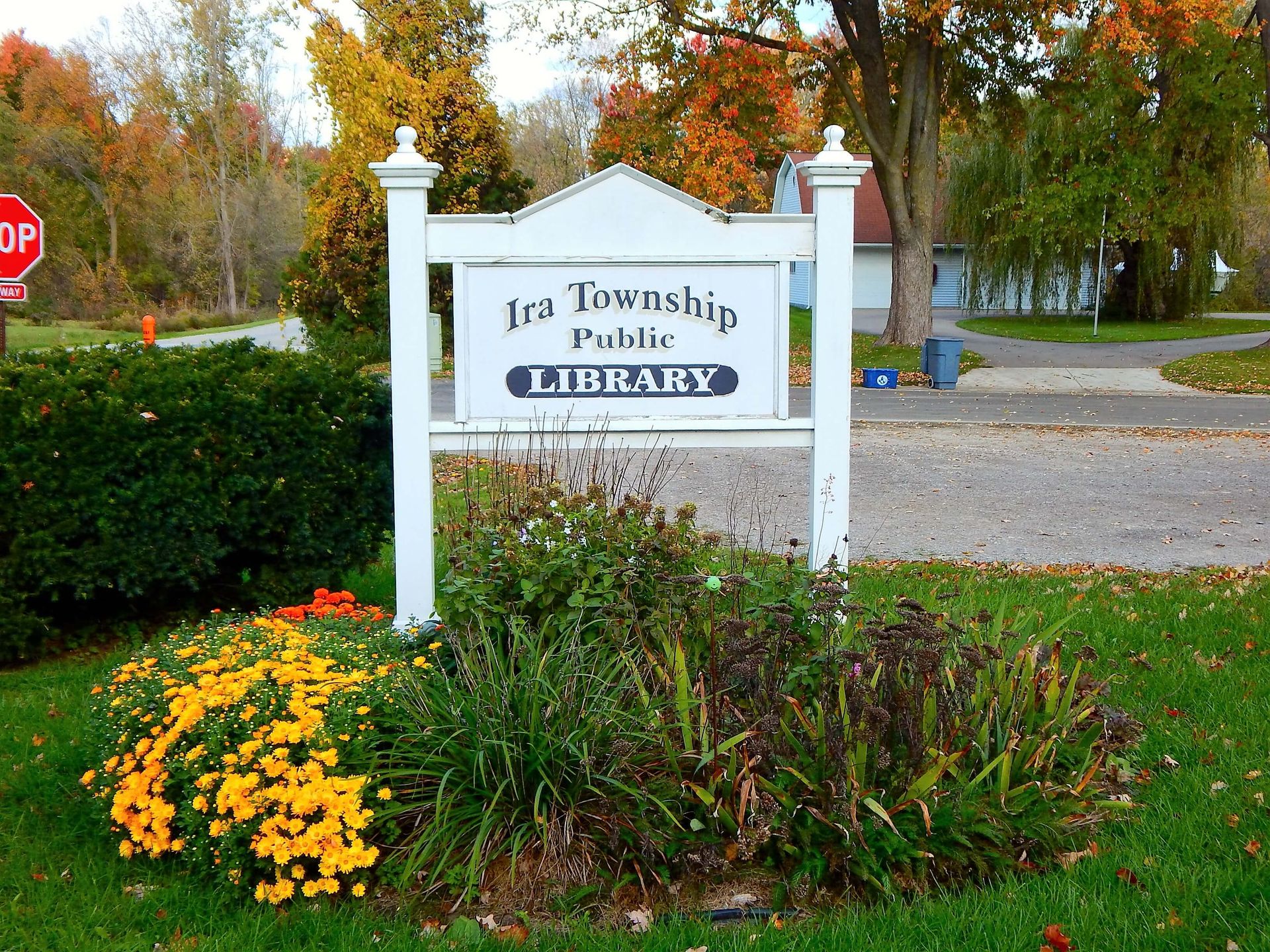 A sign for the Ira Township Public Library.