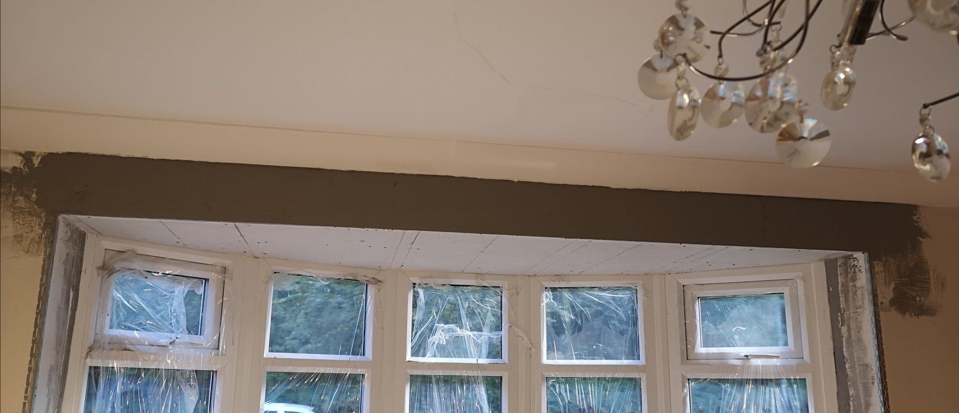 Second stage of boarding an un level bay window ceiling