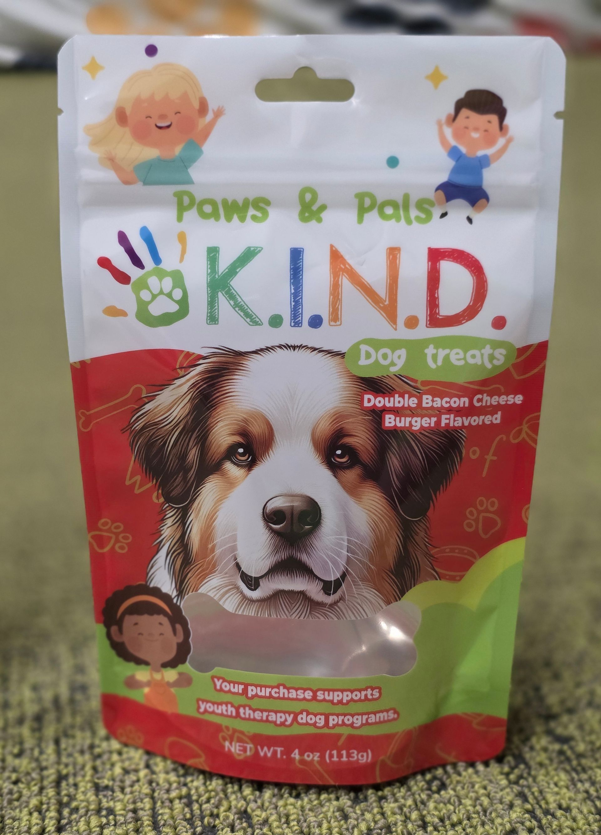 Dog treat bag featuring a dog's face, 