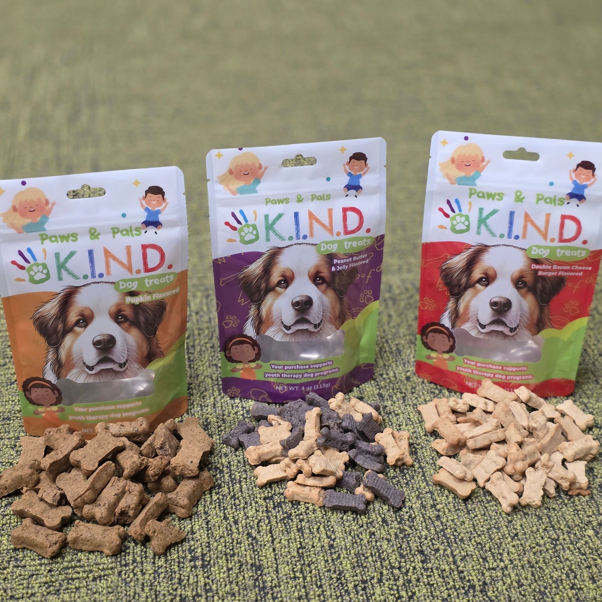 Three bags of dog treats with a dog on each bag, surrounded by treat piles.