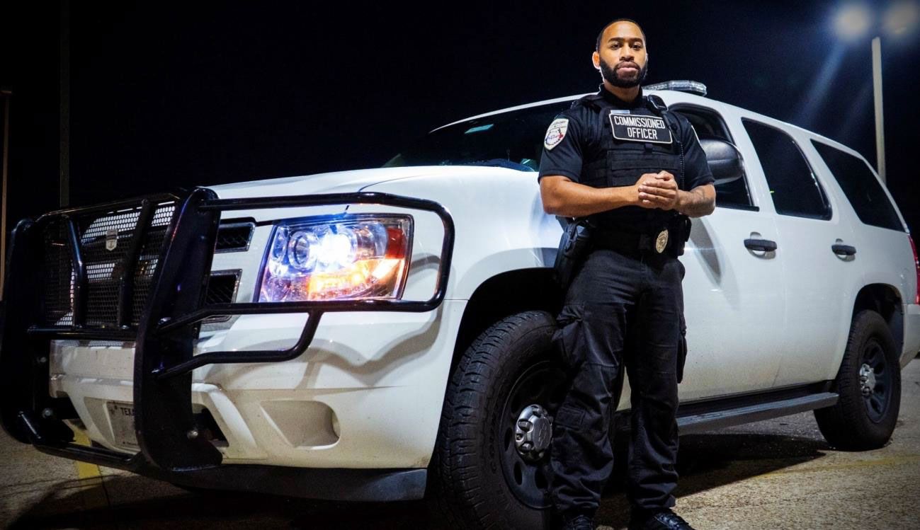 Security guard in black uniform with 