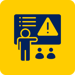 A presenter points to a board with a warning symbol and a list, while two figures sit below.